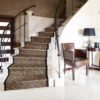 Staircase in modern house with white marble stairs and design ba